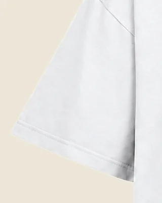 The short sleeve of the Tee 240 in White, with its folded and stitched sleeve hem.
