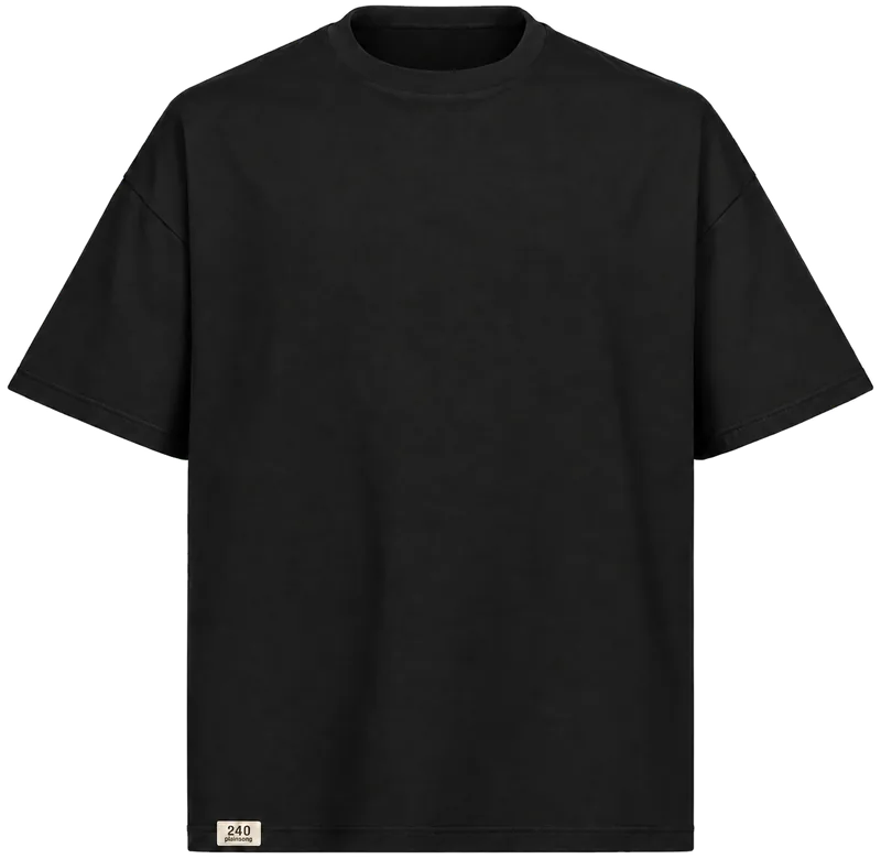 Tee 240 in Black, seen from the front: an oversized boxy t-shirt with dropped shoulders, a plain chest and a small cream woven label at the lower hem.